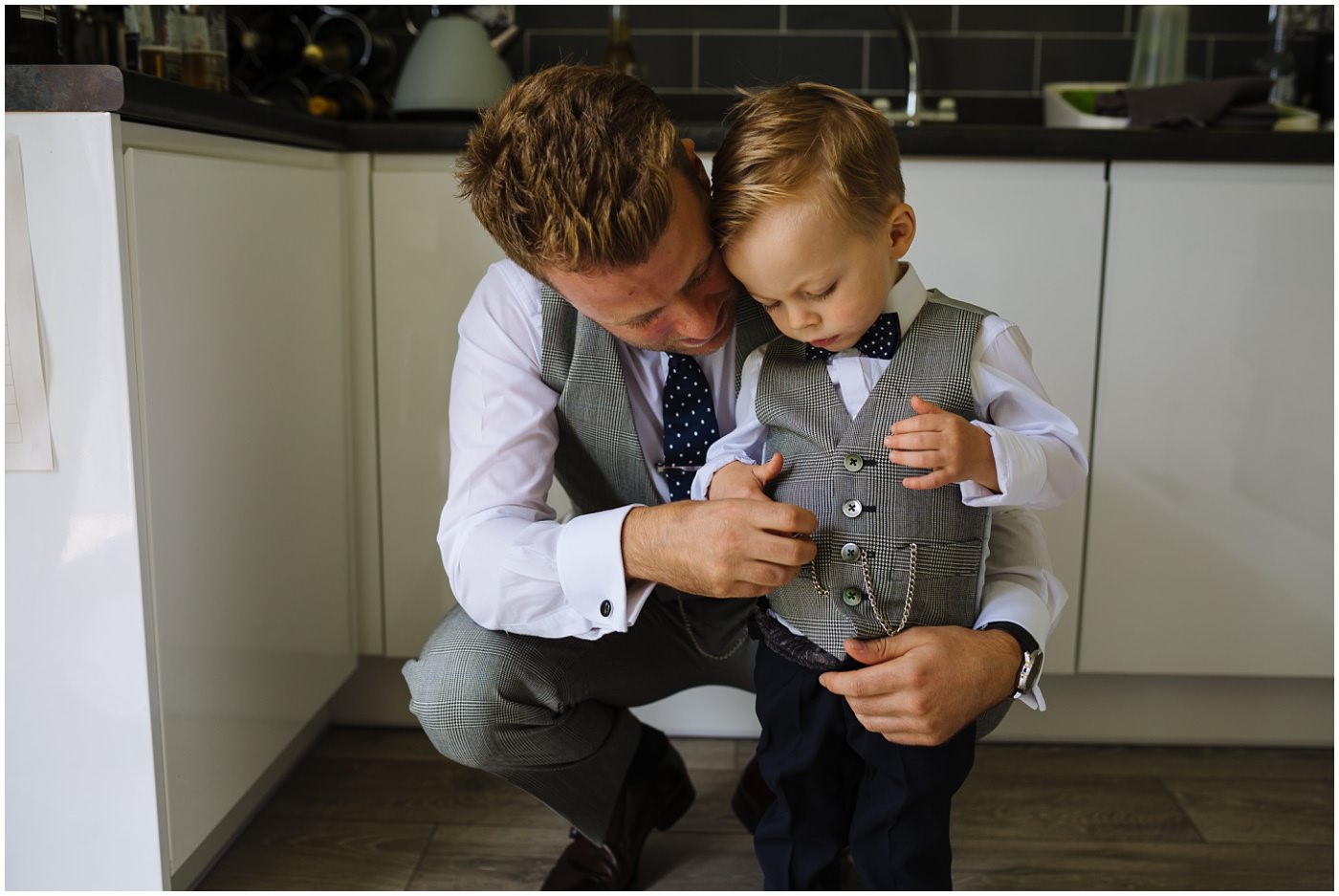 Groom and son in matching whitfied and ward suits