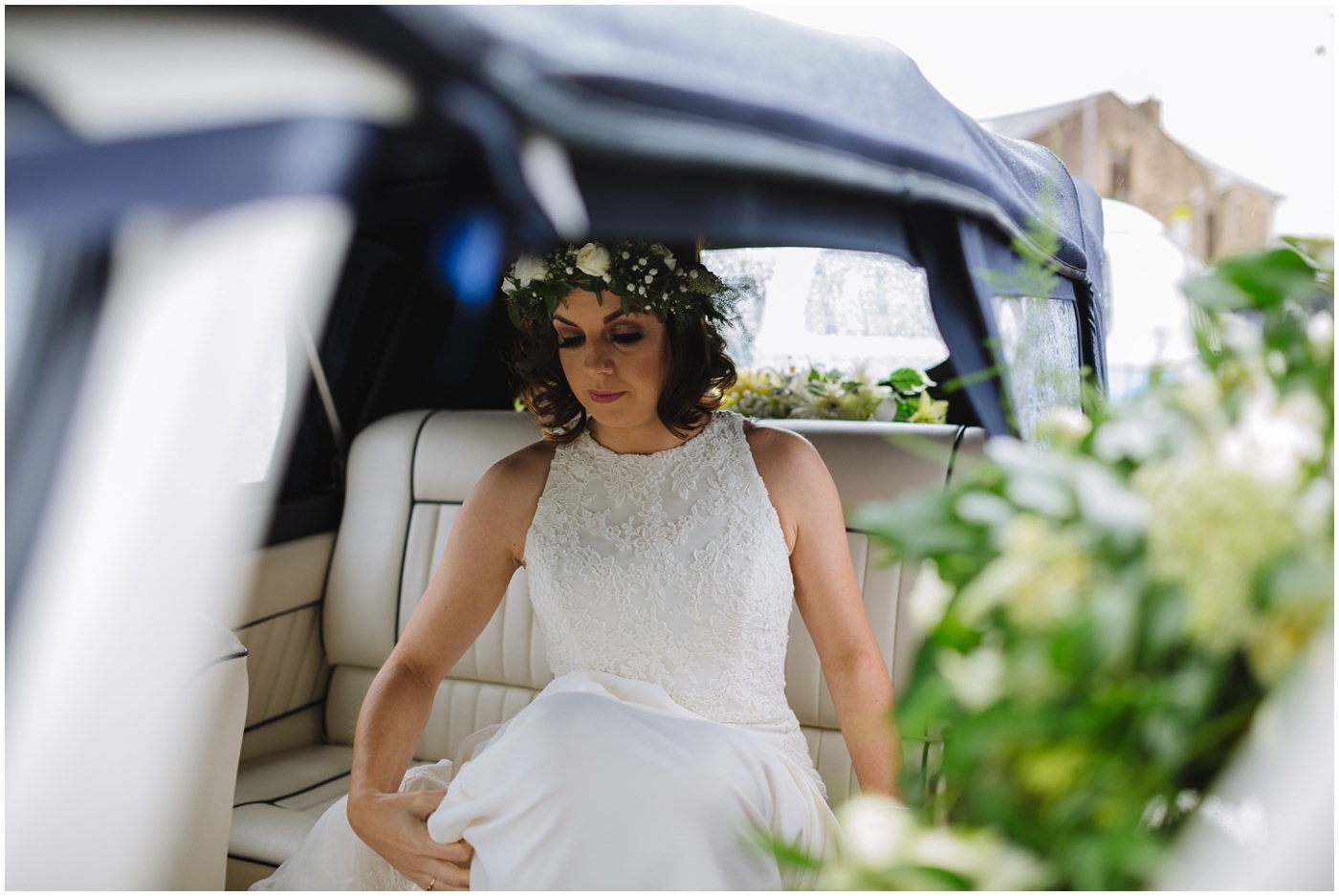 bride arrives at church in wedding car