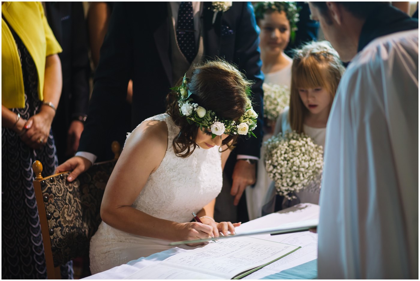 bride signs the wedding register