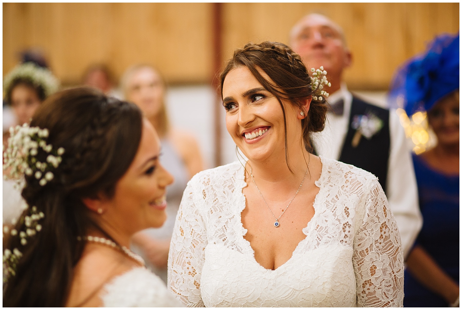 bride smiles during wedding service