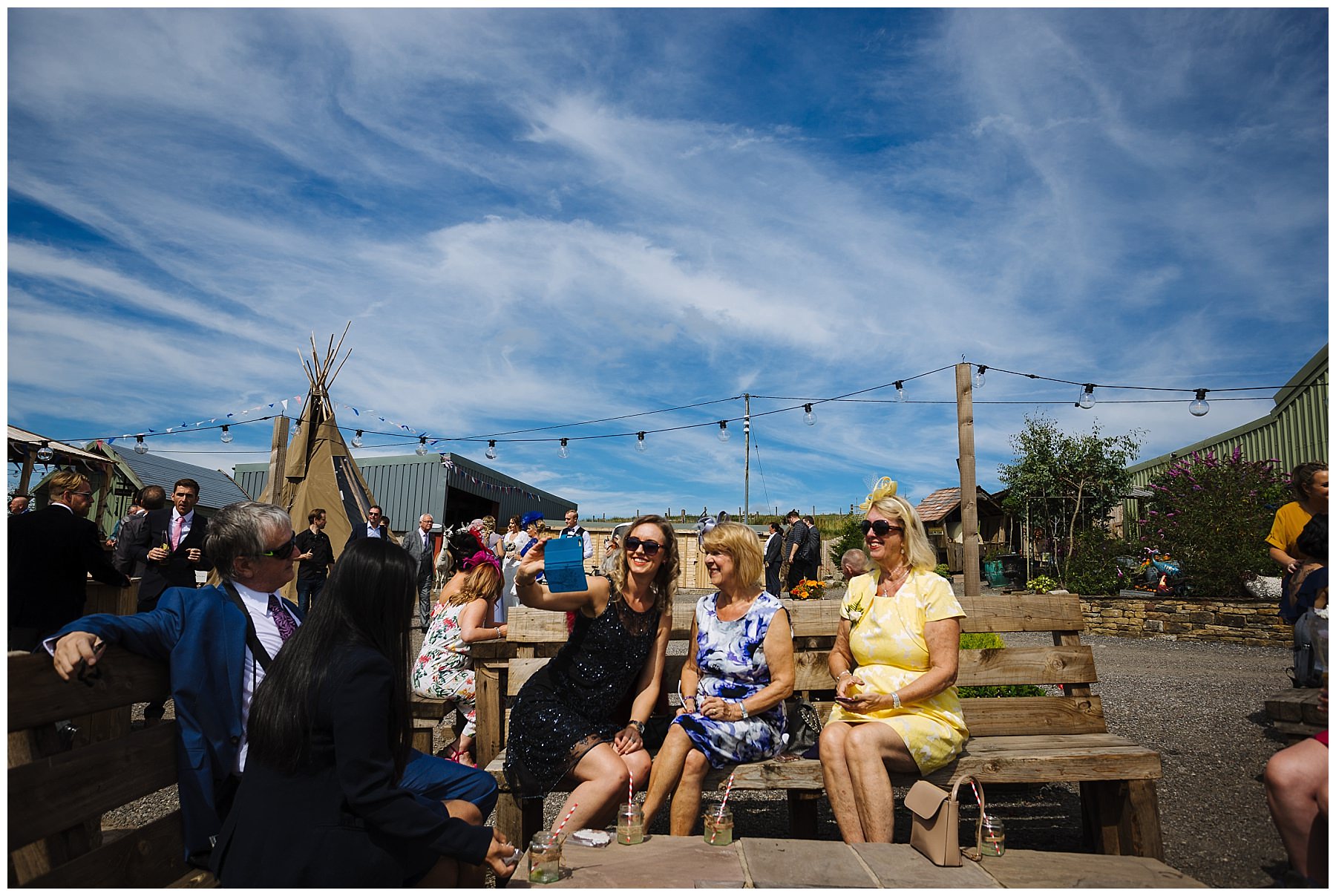 wedding guests enjoy the summer sun at the wellbeing farm