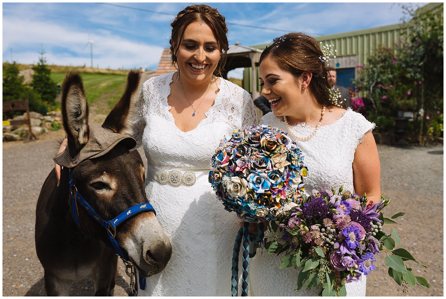 Two brides with one of the donkeys at the wellbeing farm