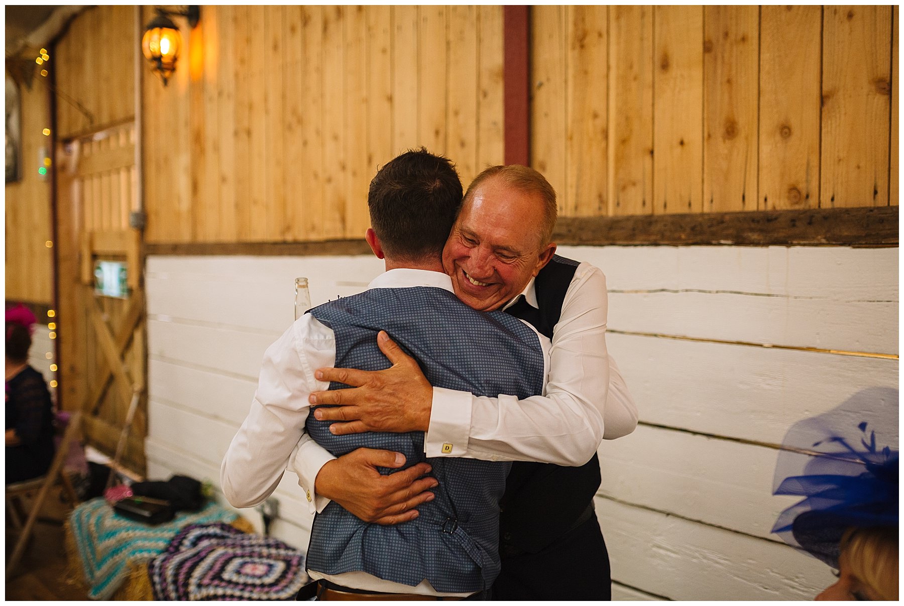 Two dads hug after speeches