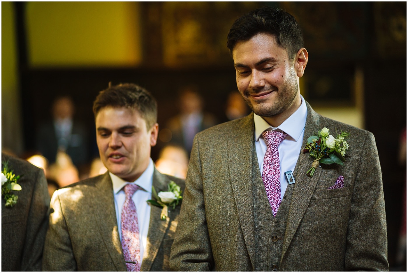groom waits nervously for his bride in the ceremony room at samlesbury hall
