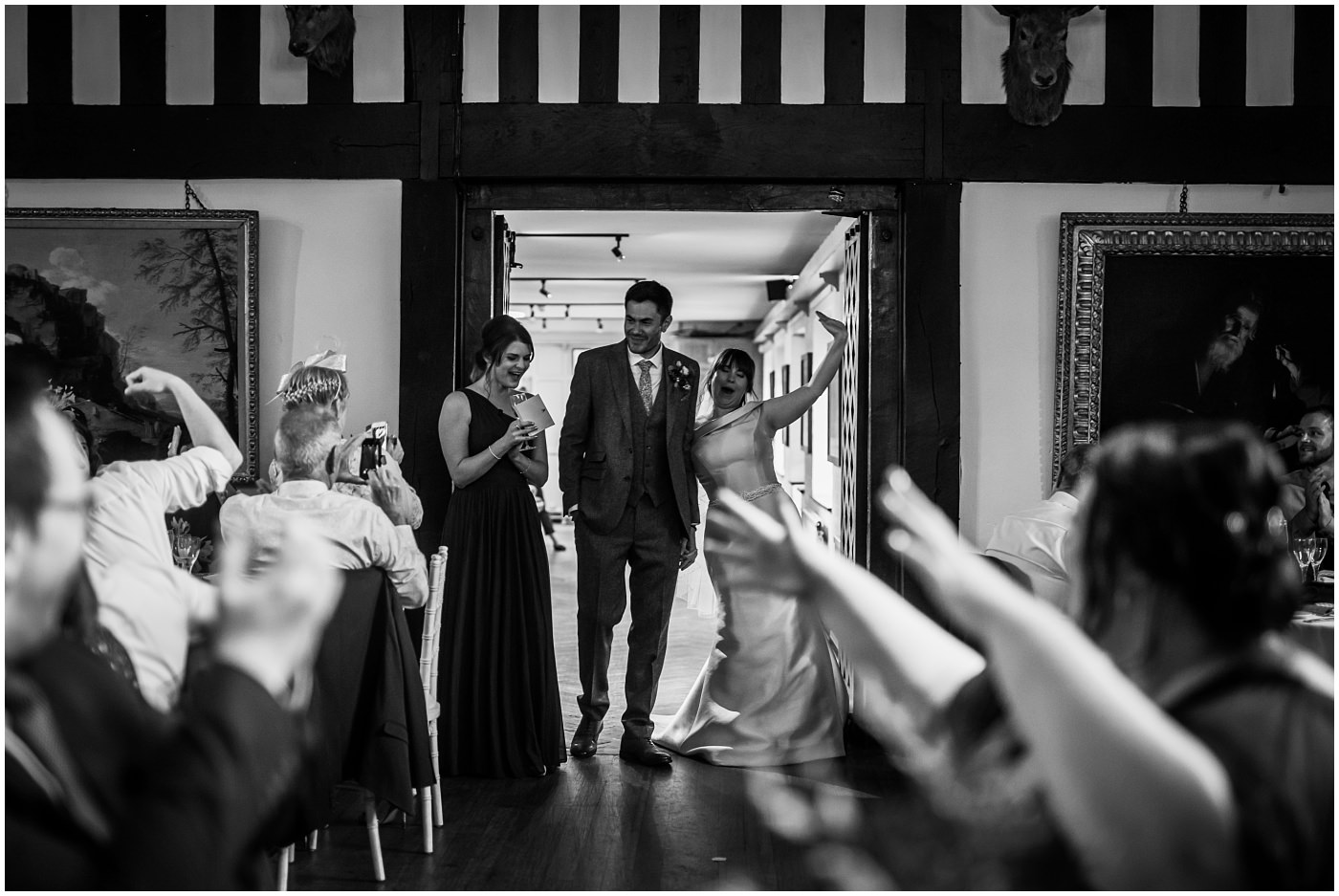 newlyweds enter the room to massive applause at samlesbury hall